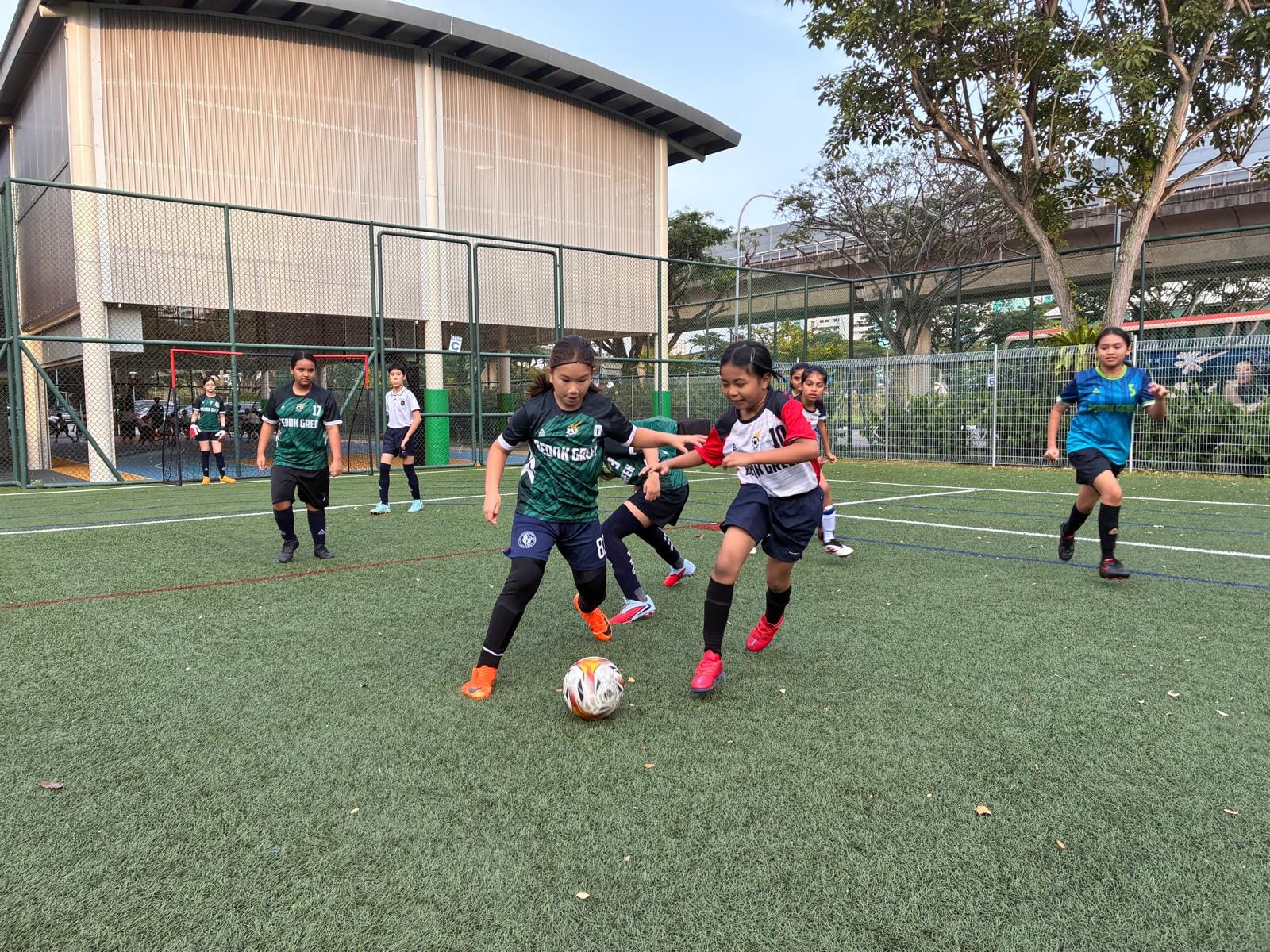 2 girls playing football